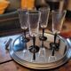 4 clear glass flutes with black stems. 1960–1970. 4 clear glass flutes with black stems.