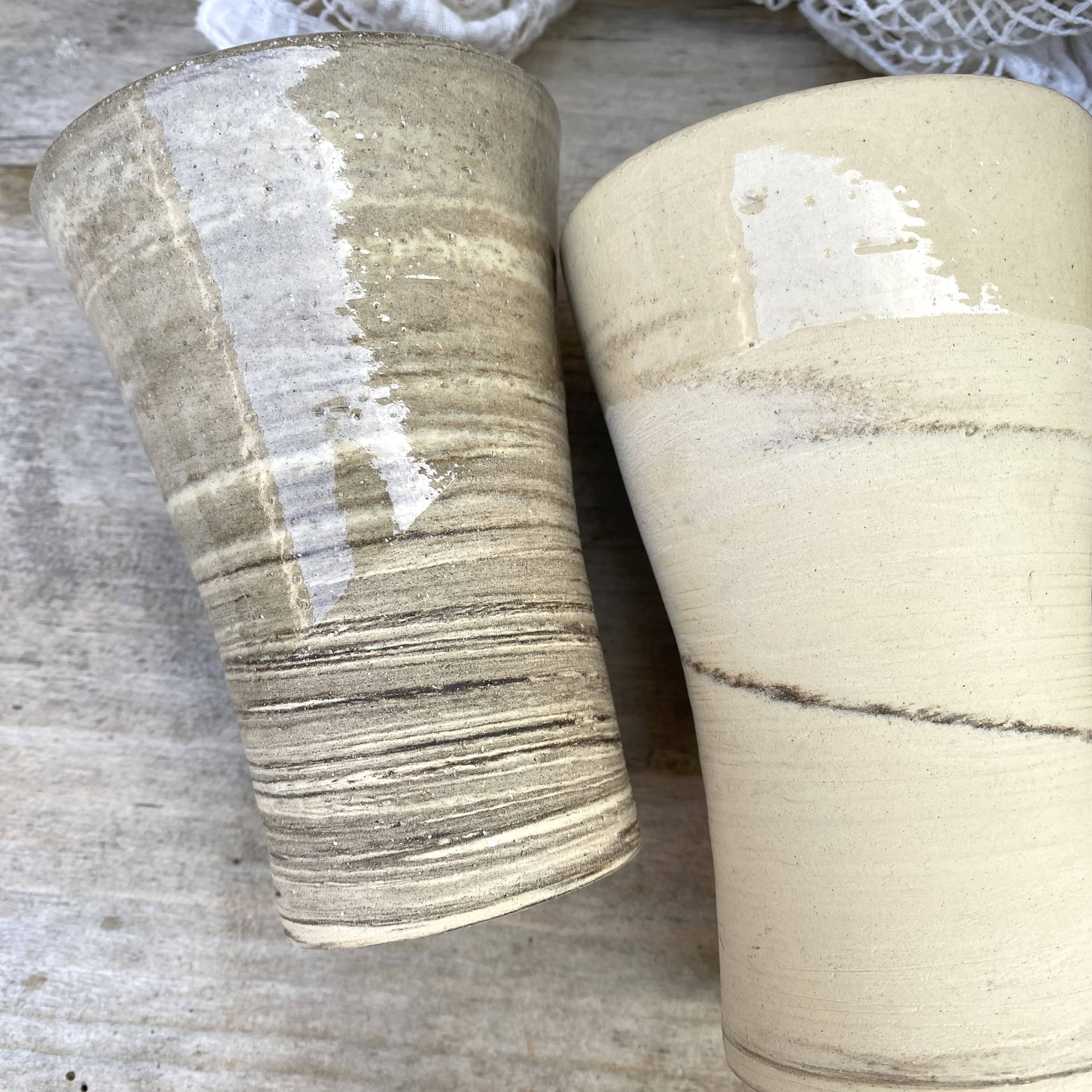 High ceramic cups made of mixed clay.