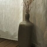 Old light grey ceramic bottle