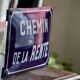 Old Enamelled and bulging "Chemin de la Rente" street plate, in perfect condition, on its cast iron support