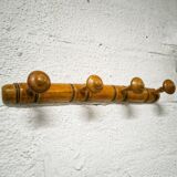 Turned wooden coat rack