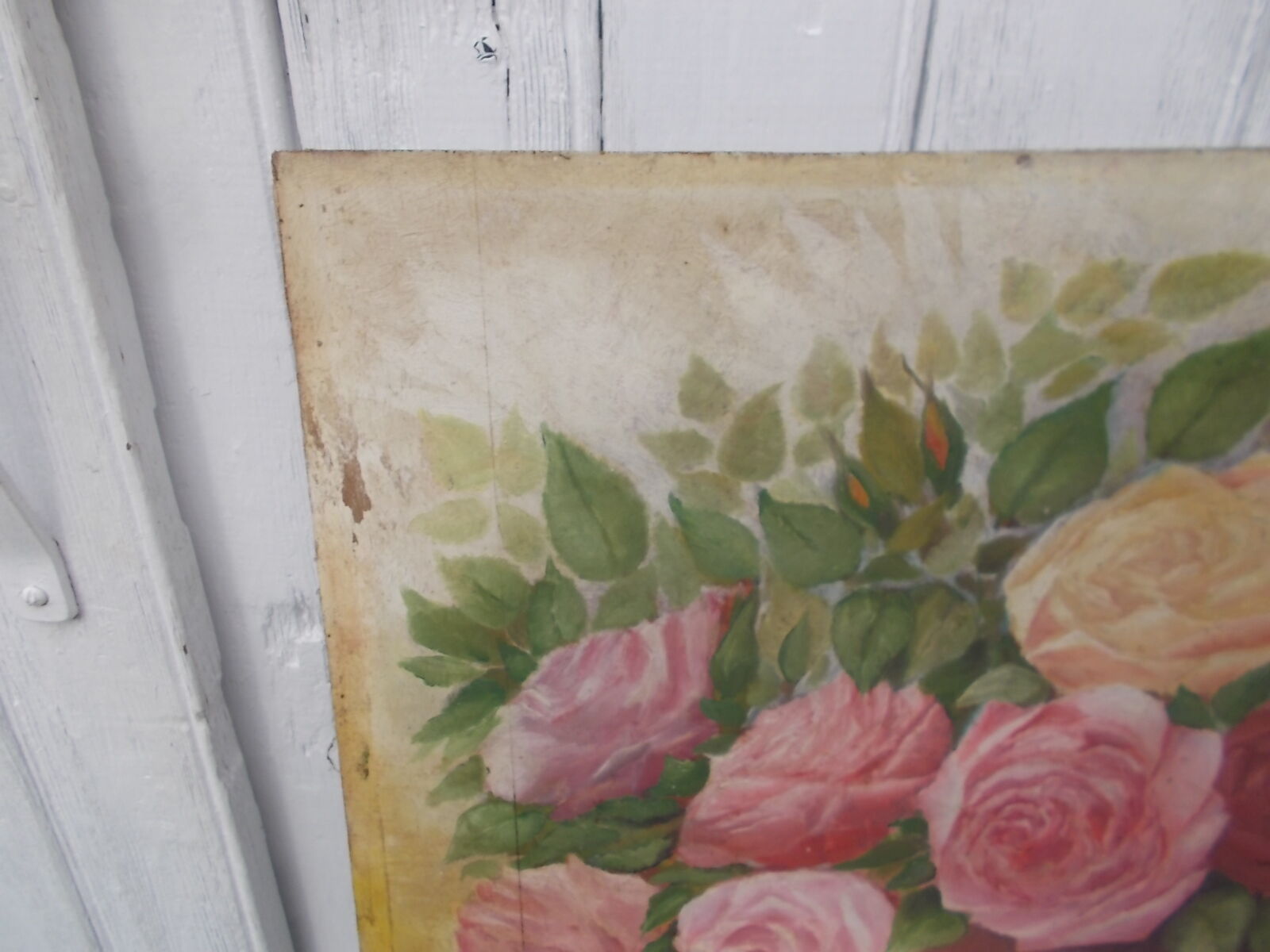 Tableau of a bouquet of flowers on a double-sided wooden panel.
