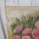 Tableau of a bouquet of flowers on a double-sided wooden panel.