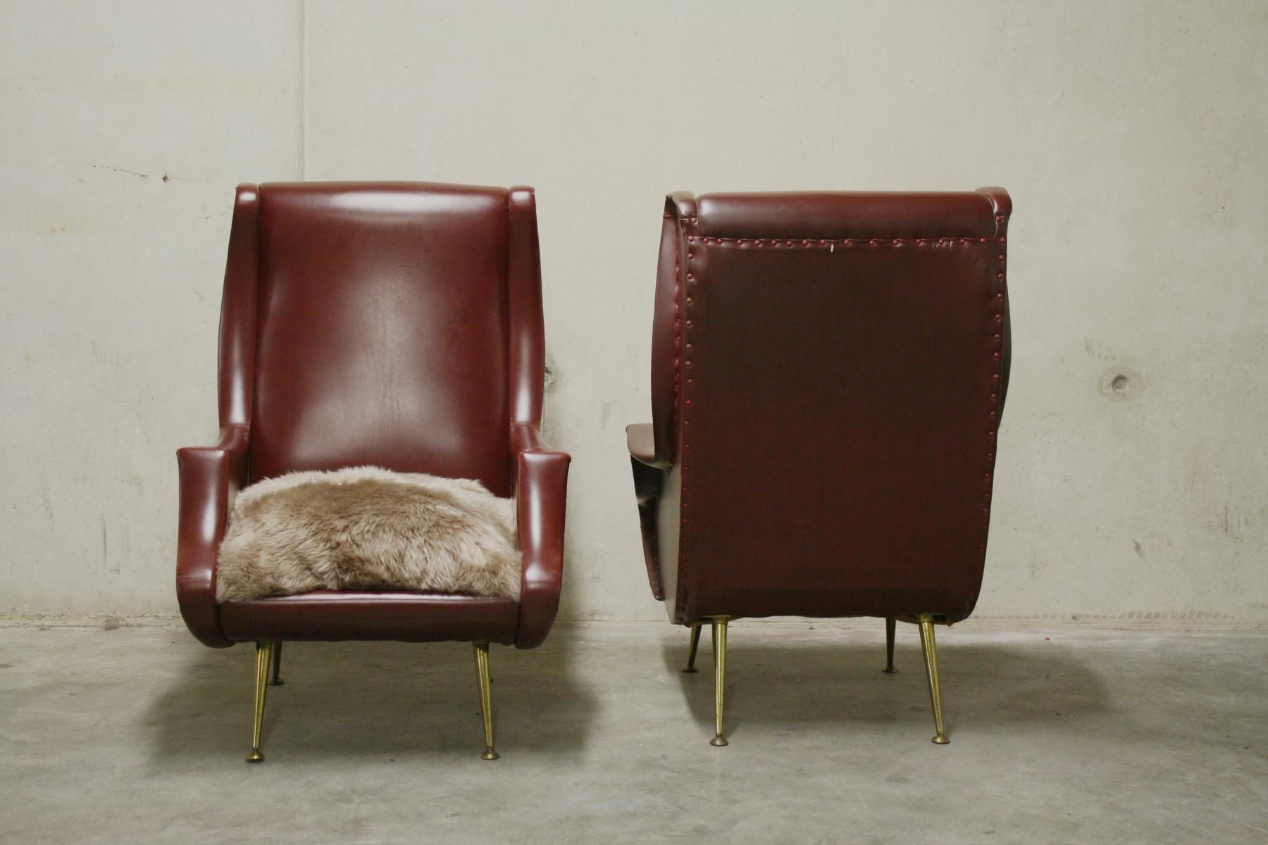 Pair of armchairs vintage with feet brass Italy 1960 s