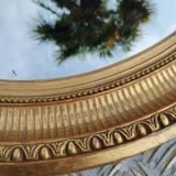 Antique oval mirror in gilded stucco with gold leaf, 19th century