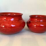 Pair of red Scandinavian candle holders.
