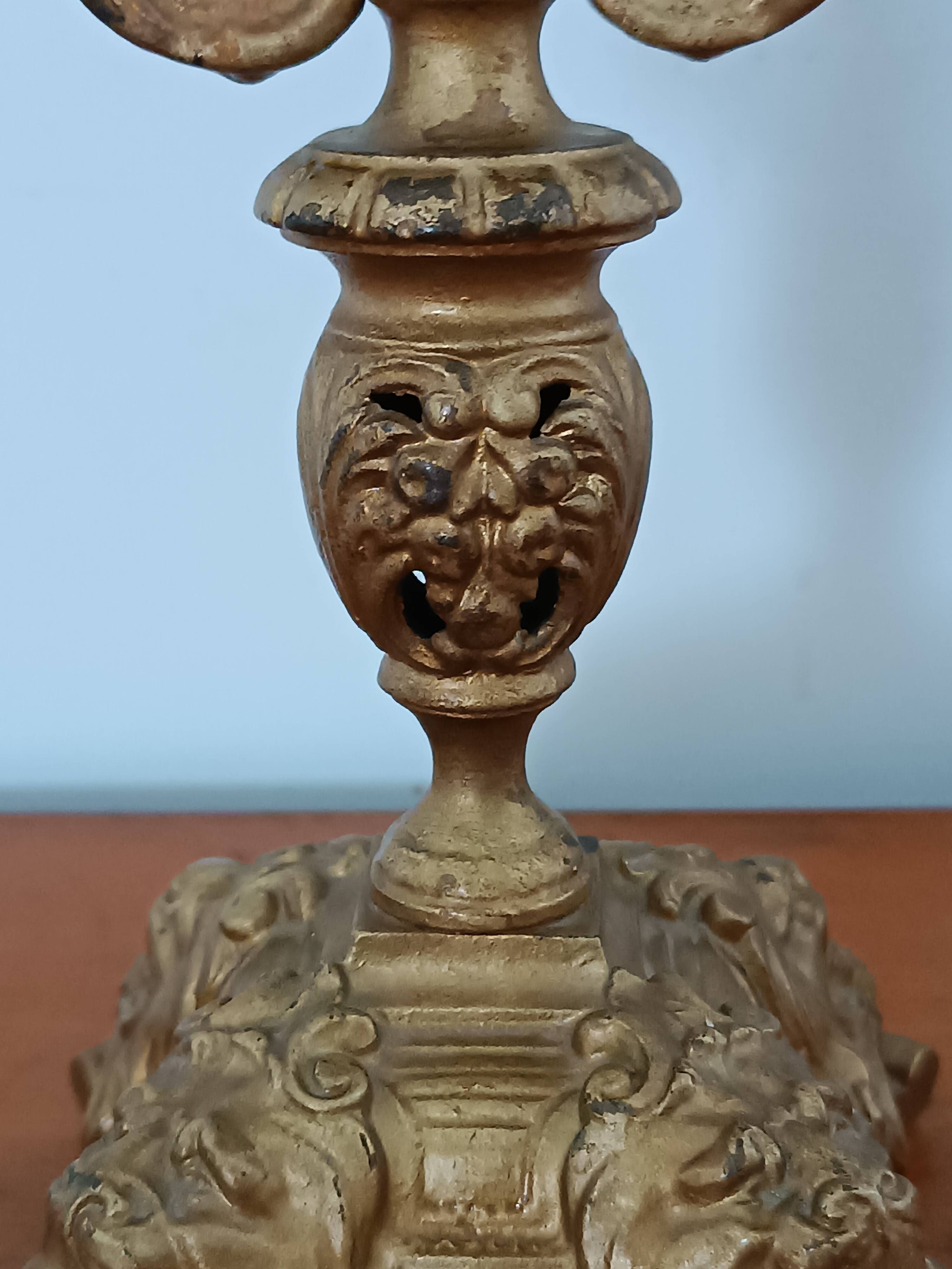 Bronze candlestick with lion head decoration