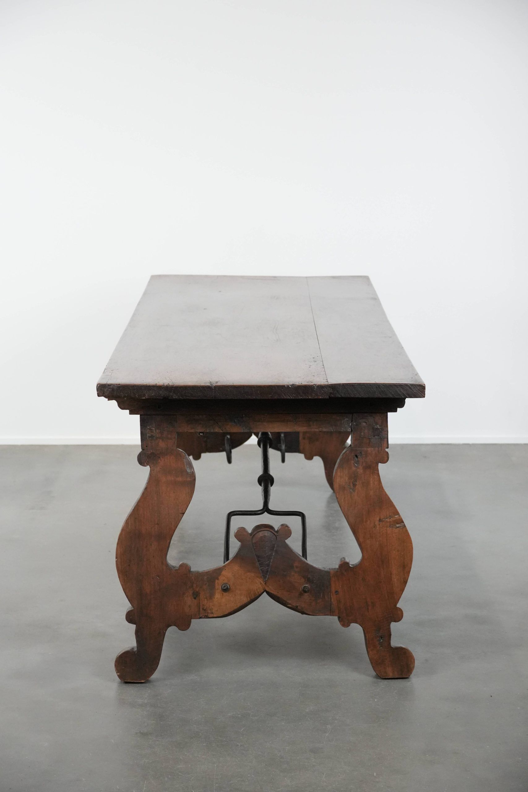 Antique 18th-century Spanish dining table with a wrought iron base