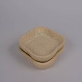 Ceramic pocket emptier