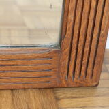 Beveled mirror grooved wood