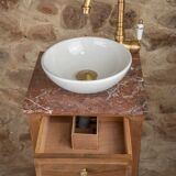Small antique washbasin in wood and red marble.