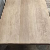 Industrial table with oak top and cast iron central leg