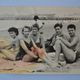 Old film photo circa 1950 the beach group of teenagers
