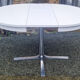 Round table in white formica, retractable, vintage, Collomb creation, 70s