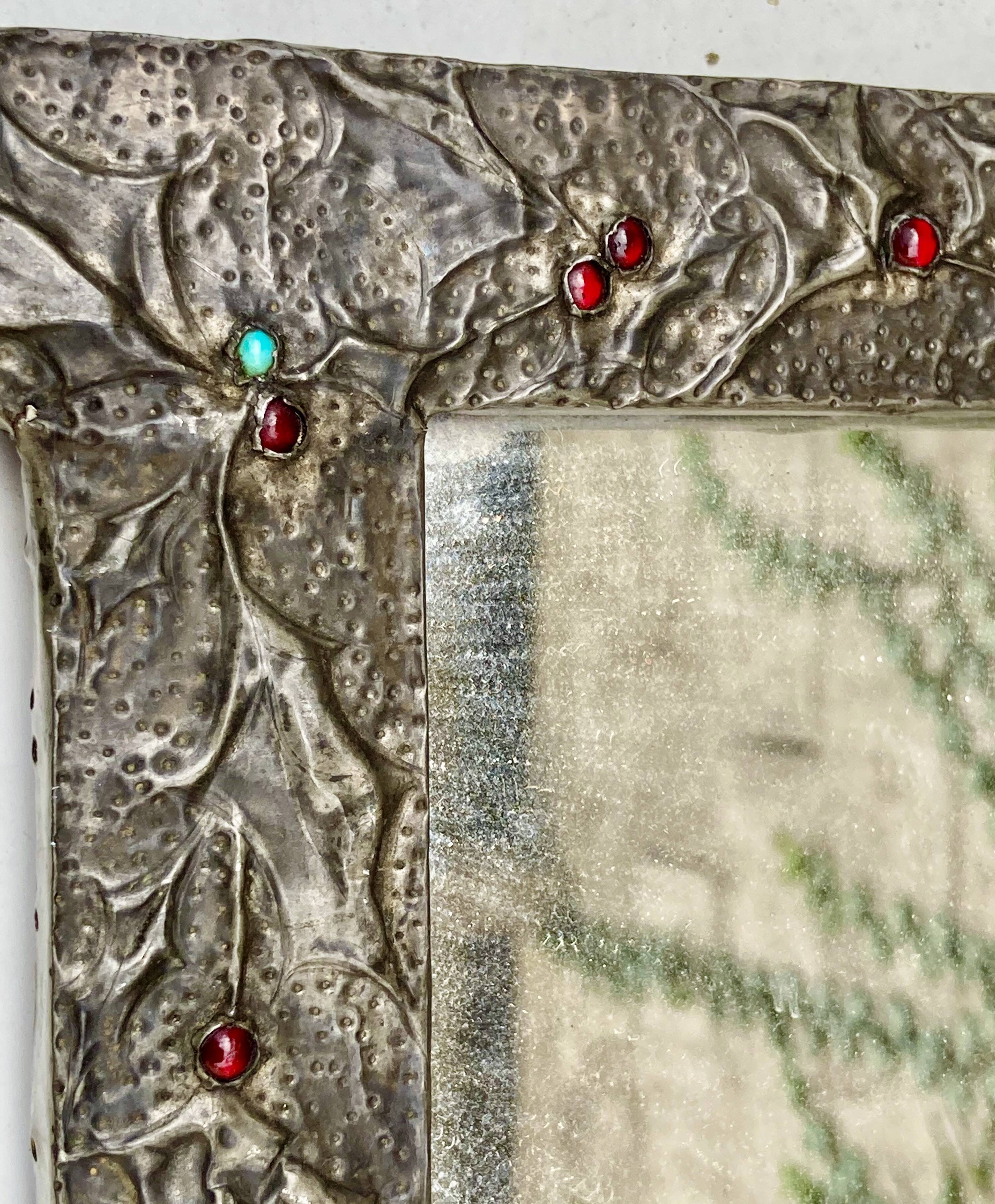 Mirror with embossed metal frame by alfred daguet, 1900s art nouveau period