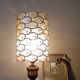 Table lamp with wooden base and mother-of-pearl fish and brass lampshade