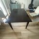 Solid cherry wood dining table, extendable for 8 to 12 people.