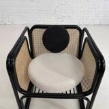 Cubic armchair in black rattan and canework