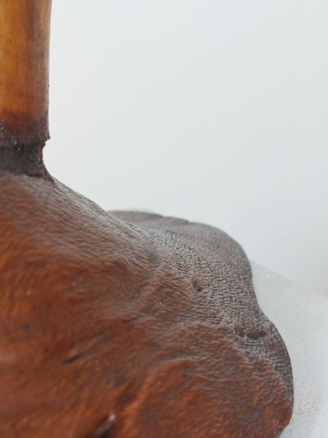 Vintage candle holder in an organic shape with a brass spike and tiered top.