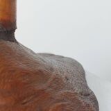 Vintage candle holder in an organic shape with a brass spike and tiered top.