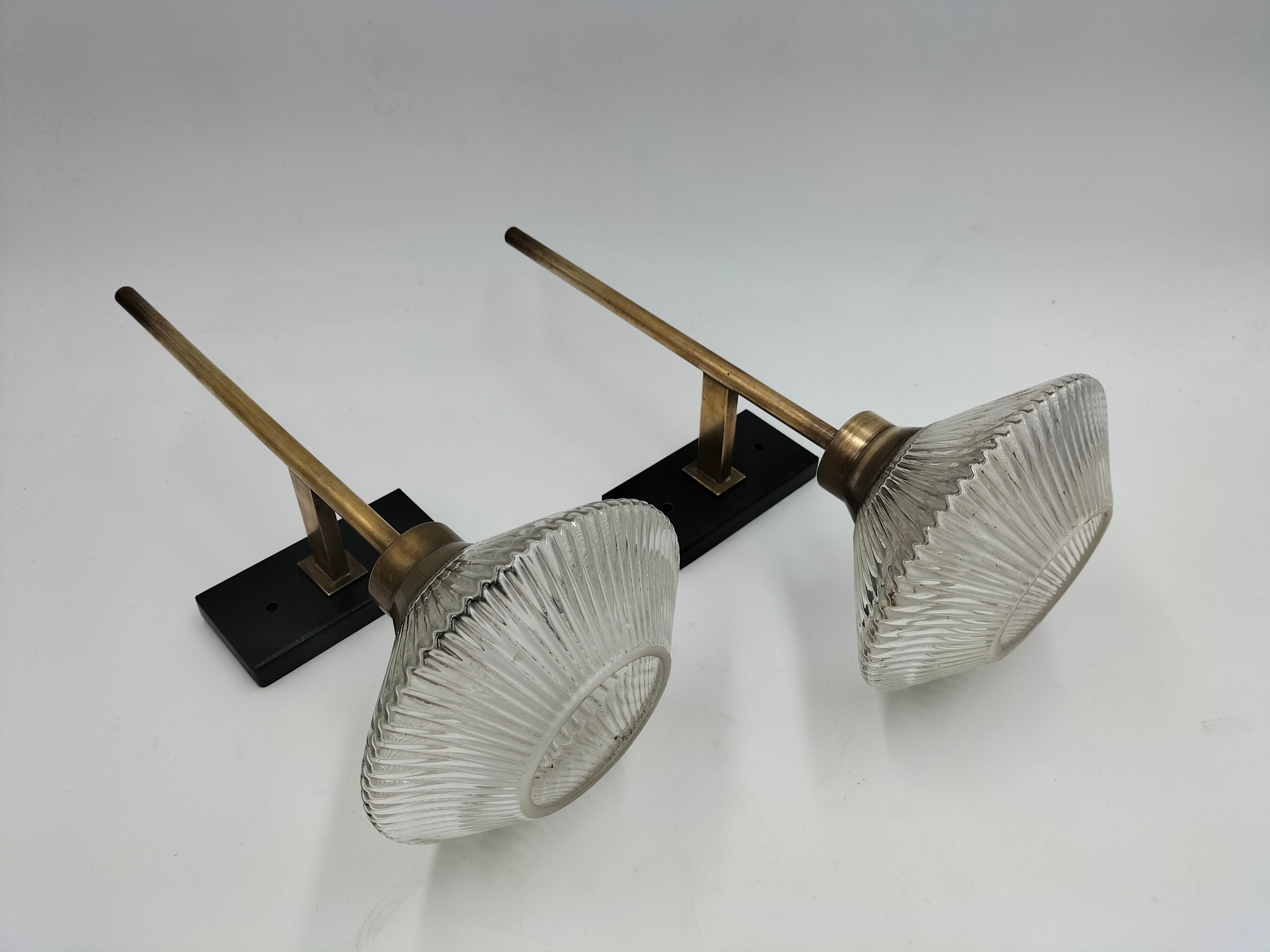 Pair of brass and glass wall lamps