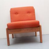 1970s chair in oak and orange cushions