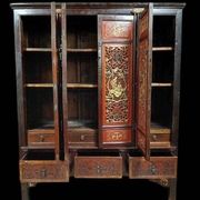 China 19th century: Red lacquer cabinet with gilding from the Qing Dynasty.