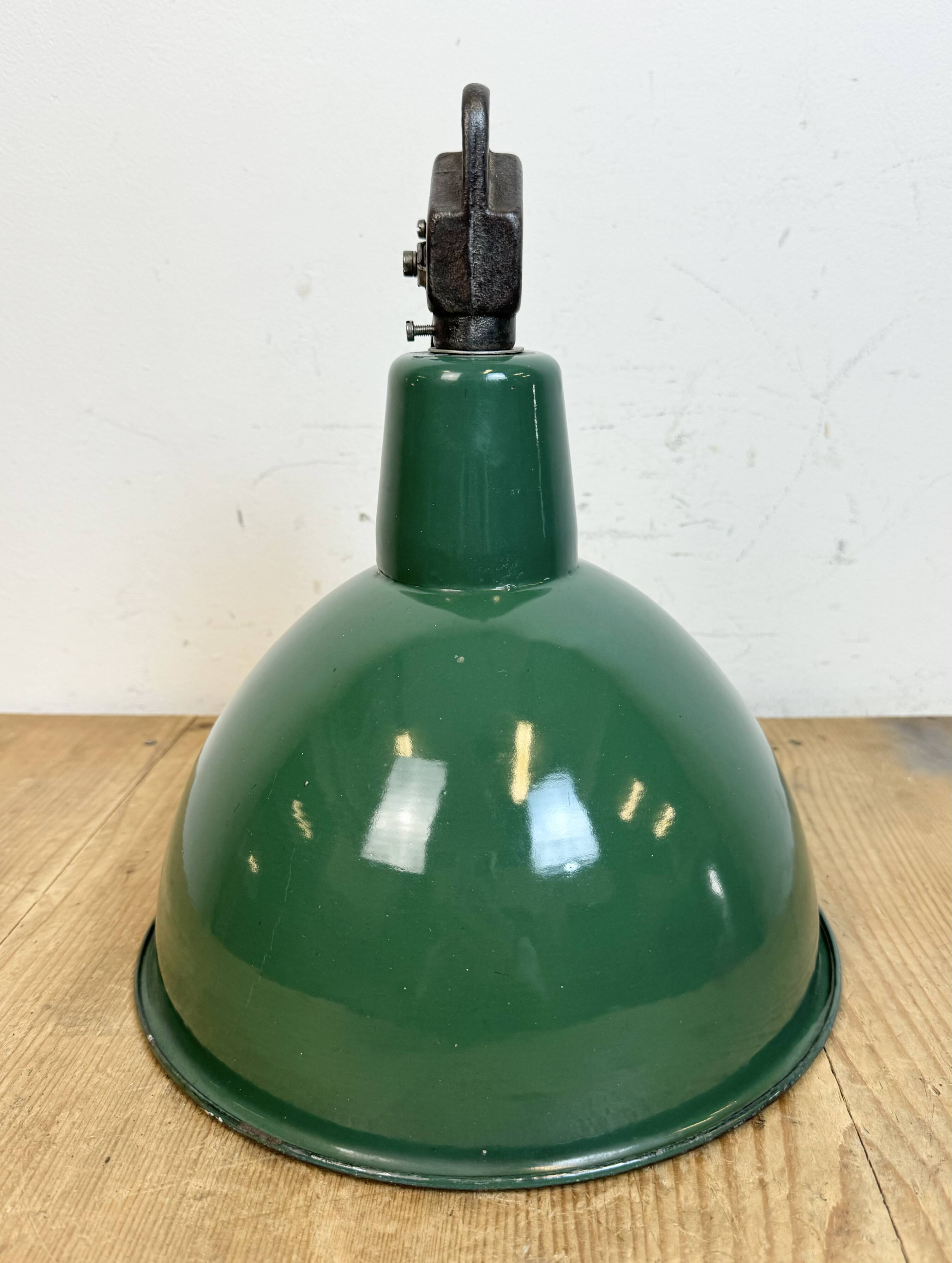 Industrial green enamel factory lamp with cast iron top, 1960s
