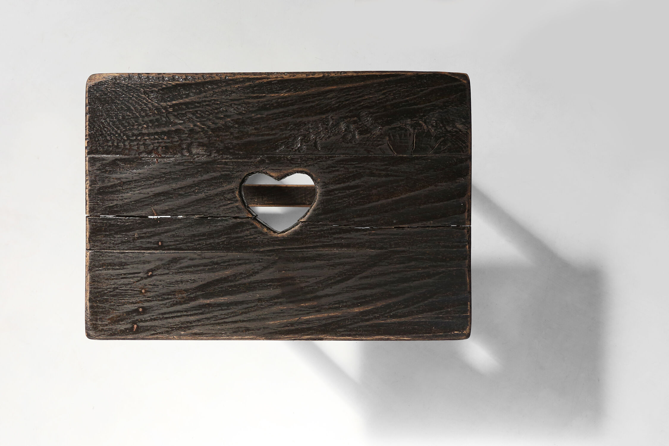 Rustic black wooden stool, Ca.1920