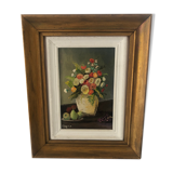 Tableau à fleurs, signé Roger