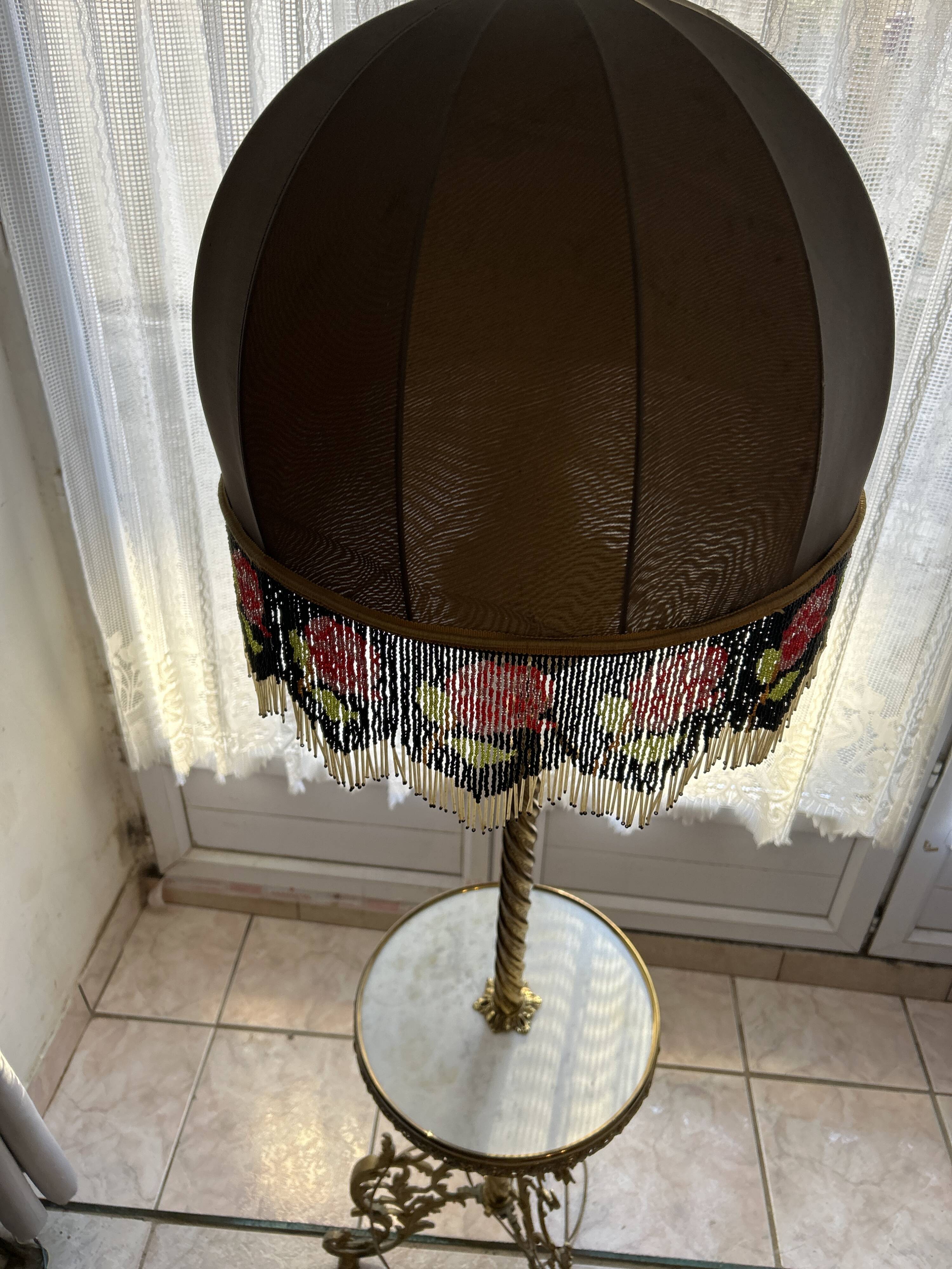 Living room floor lamp in bronze and white marble.