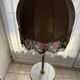 Living room floor lamp in bronze and white marble.