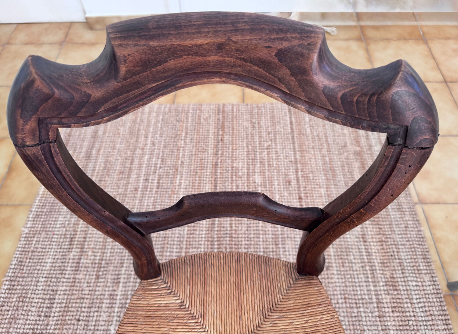 Antique wooden chairs with rush seating.