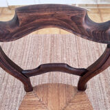 Antique wooden chairs with rush seating.