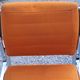 Pair of designer armchairs in orange fabrics and chrome tubes from the 70s