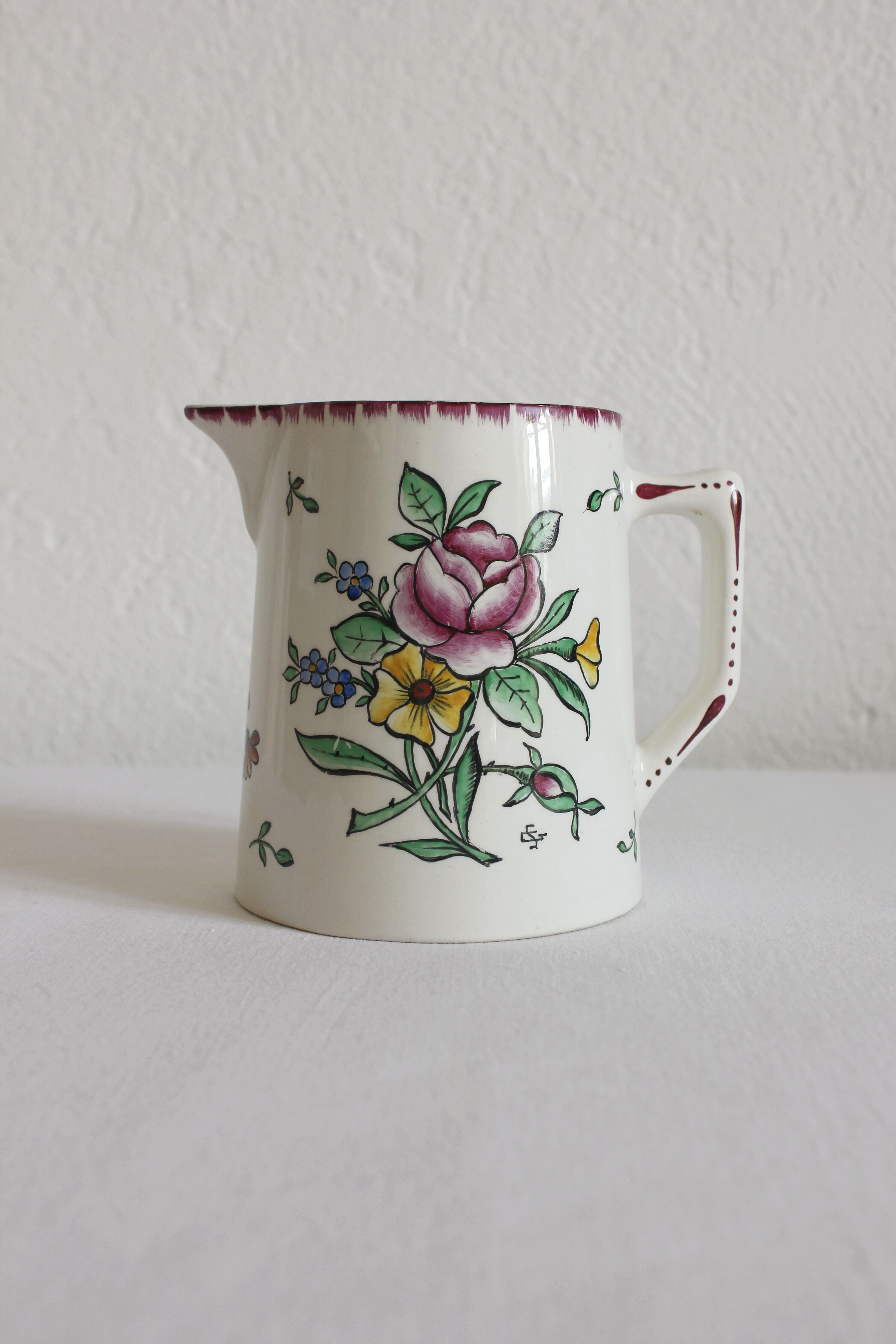 Earthenware jug with floral decoration from Digoin Sarreguemines.