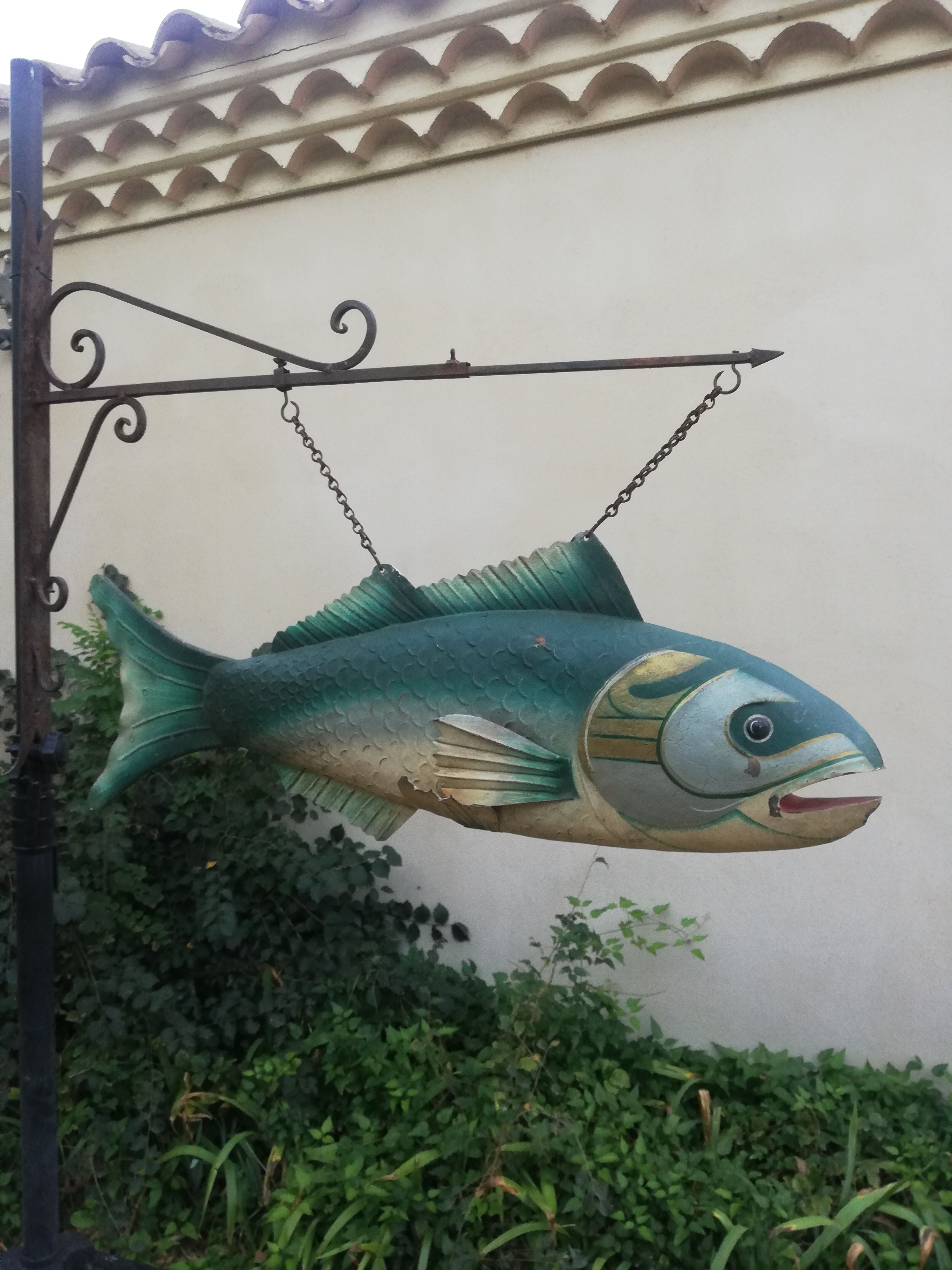 Panel depicting a fish in sheet metal