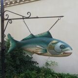 Panel depicting a fish in sheet metal