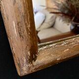 Patinated gilded mirror in wood and plaster