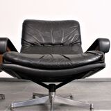 Armchair and footstool by André Vandenbeuck for Strässle in black leather