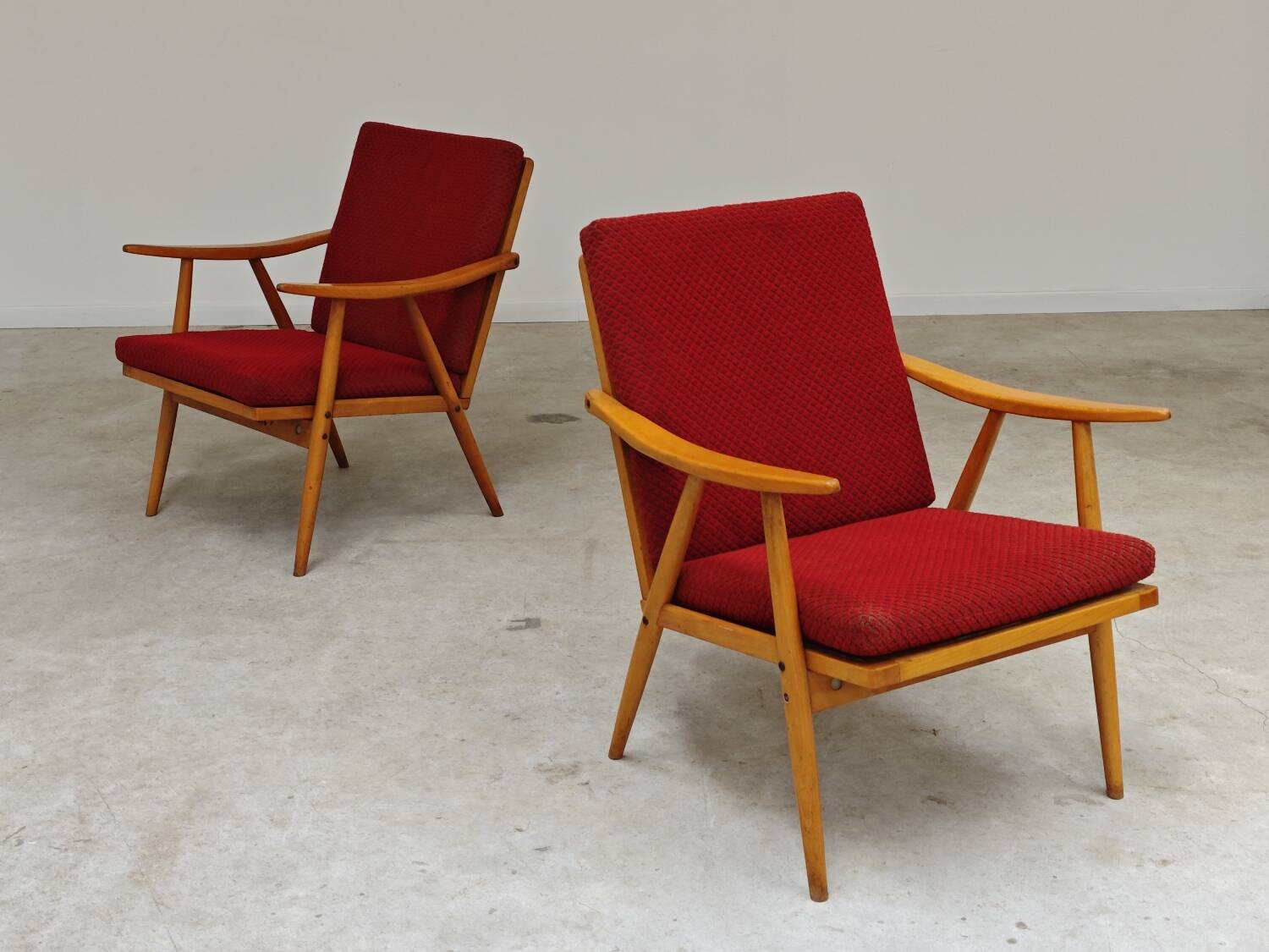Pair of red Boomerang armchairs by Antonin Suman for Ton Bystrice Thonet