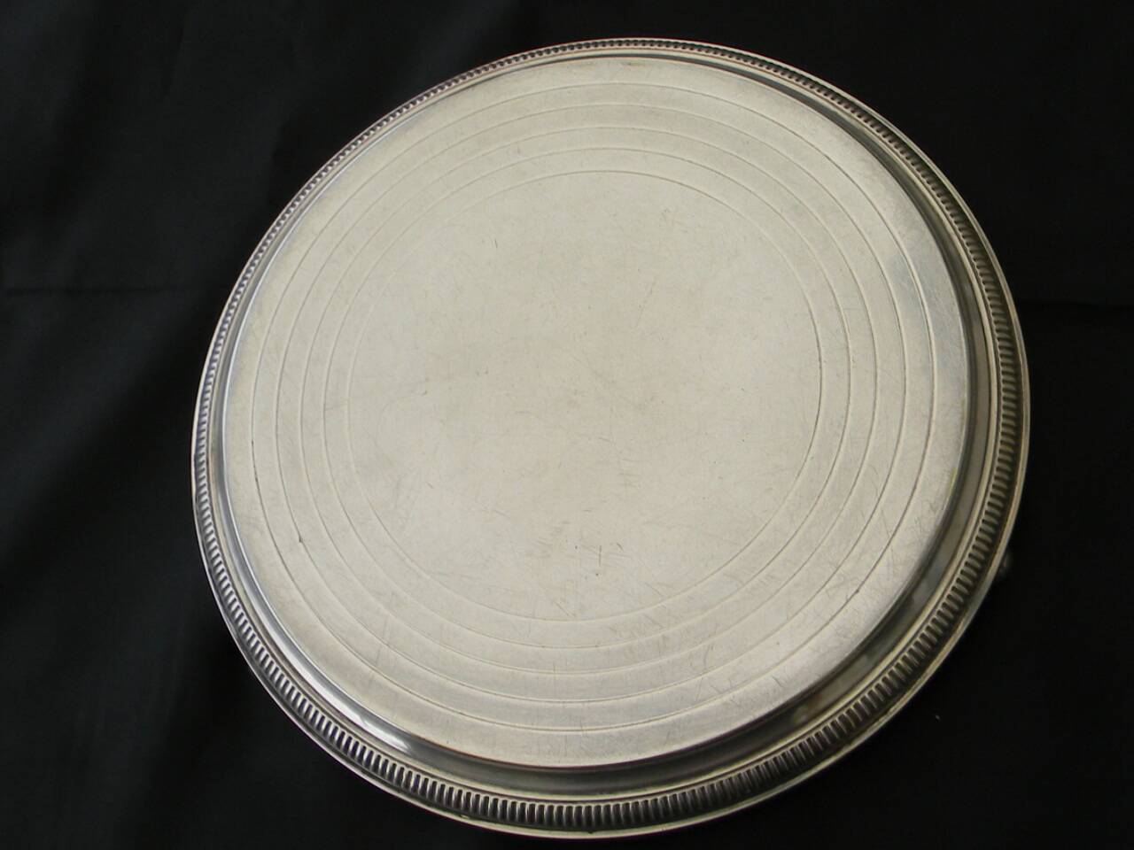 Silver-plated trivet.