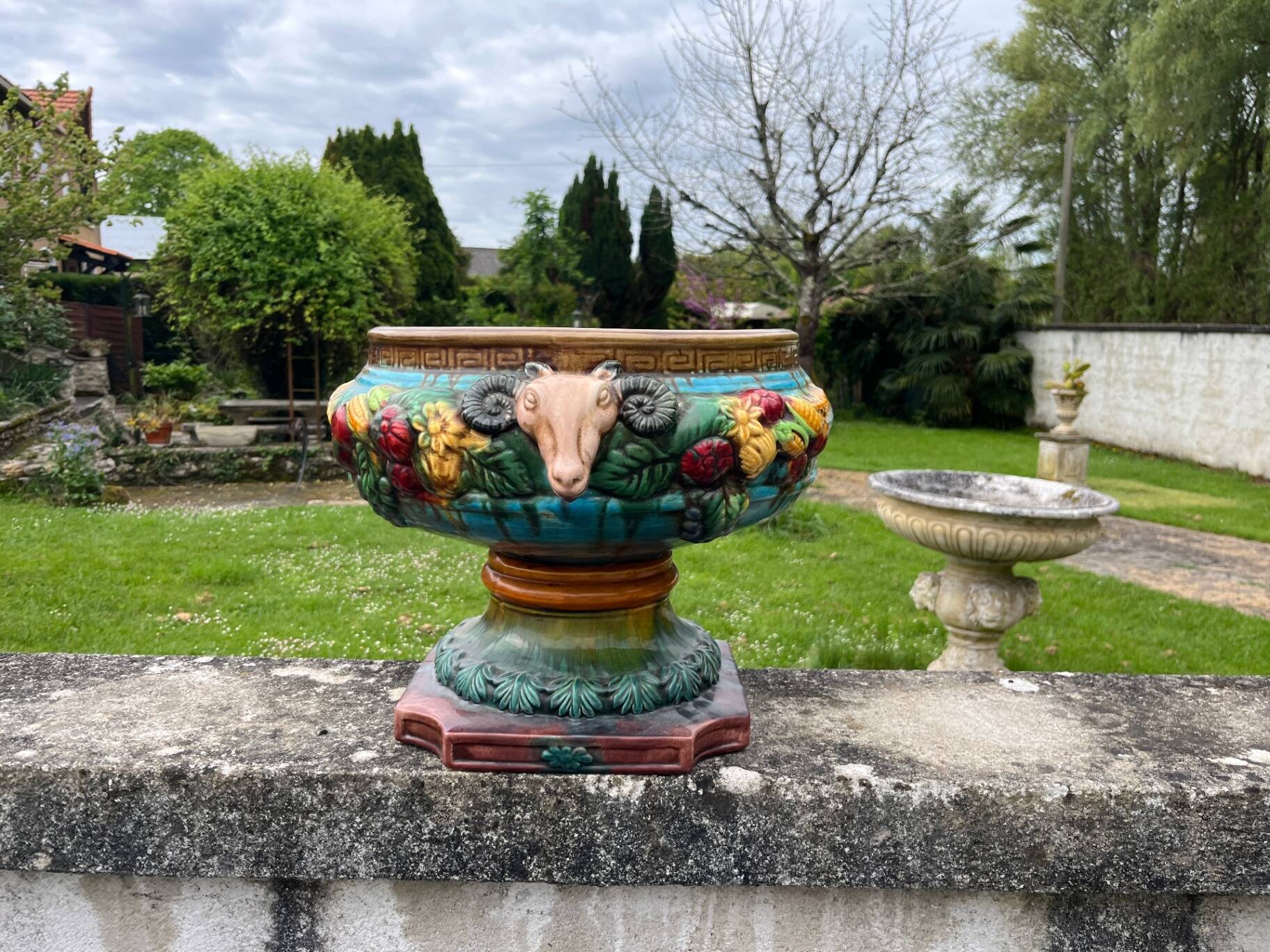 Large neoclassical majolica jardinière with ram's heads.