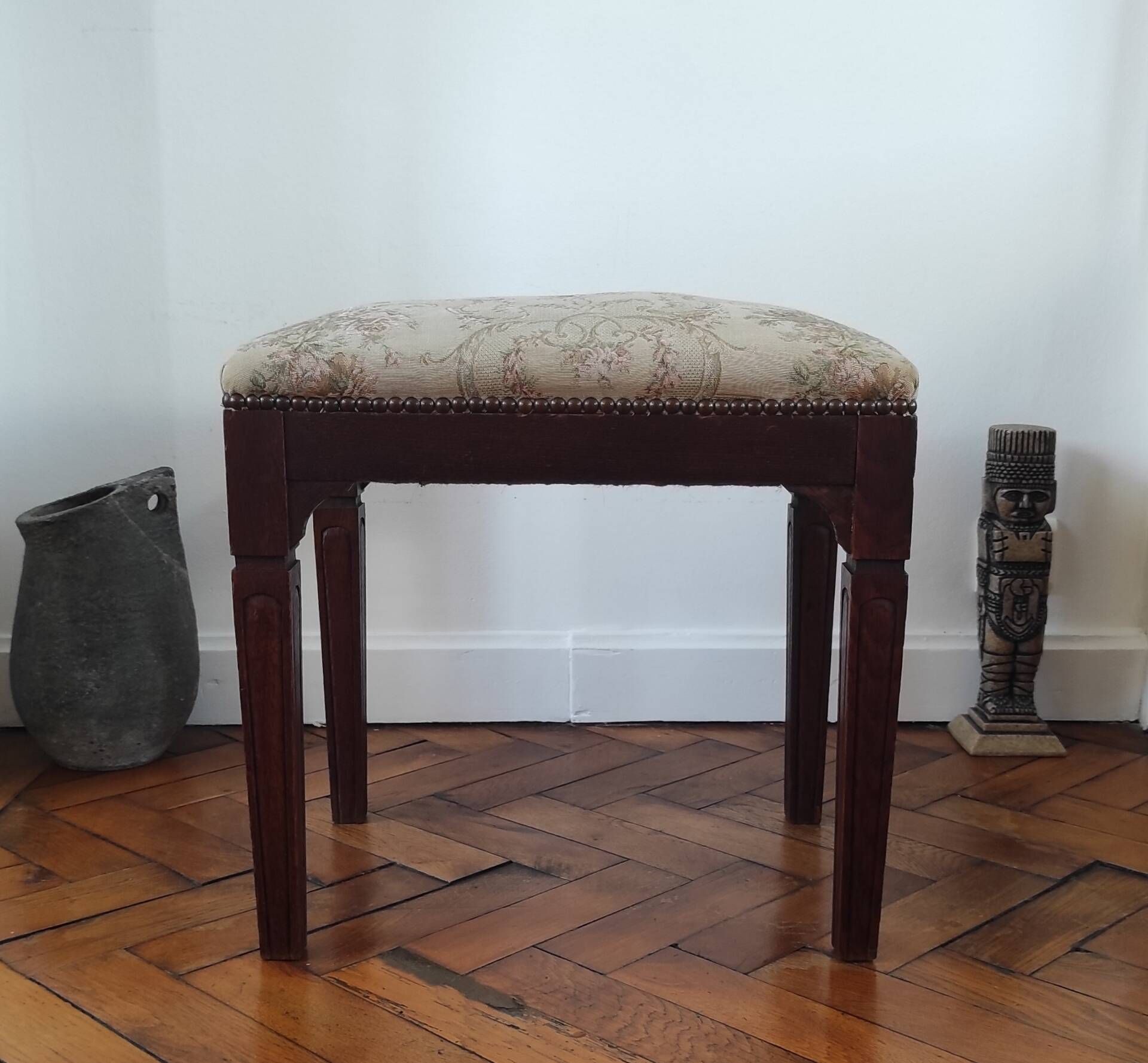 Footrest, vintage stool in solid oak with floral upholstery.