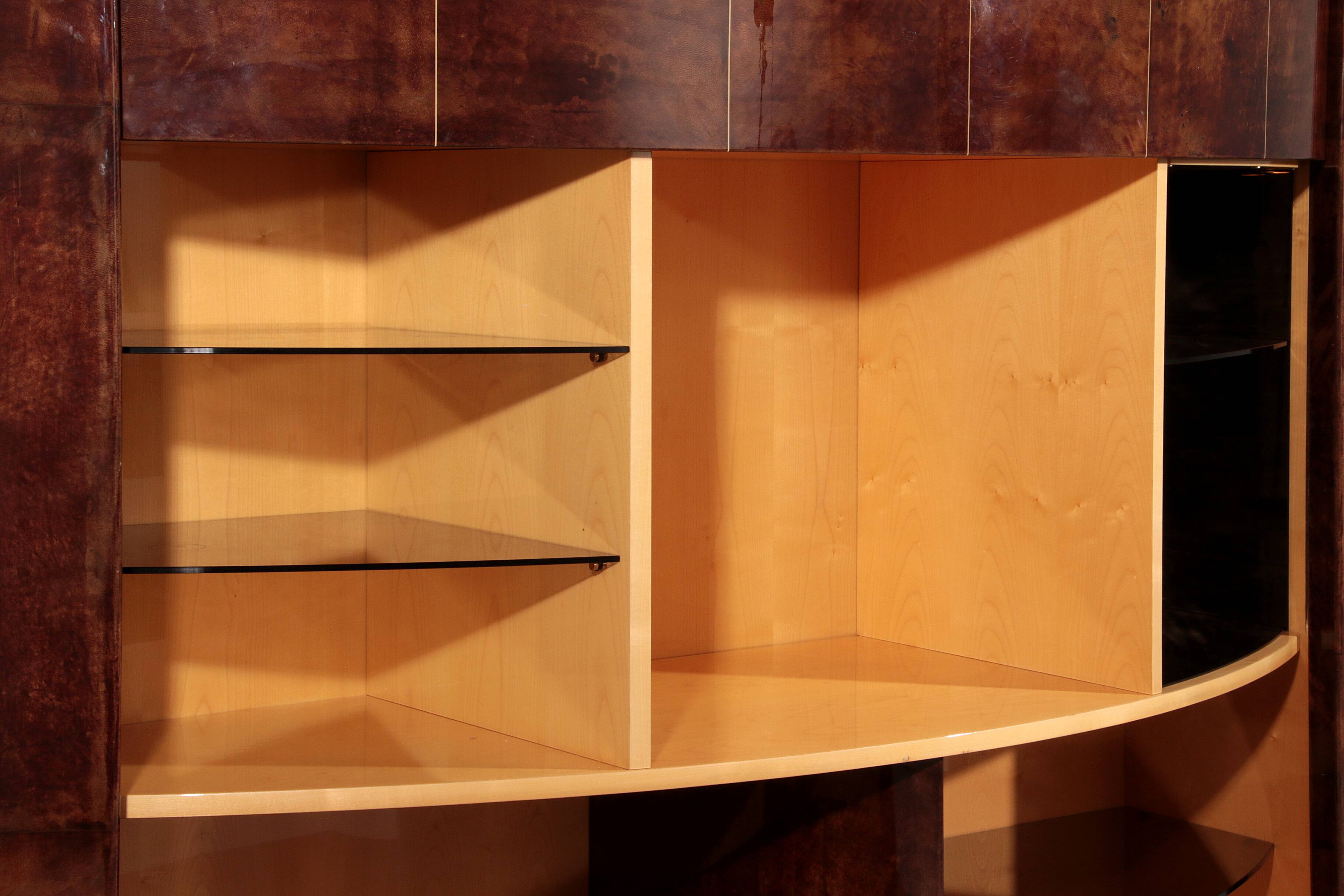 Iconic Aldo Tura brown goatskin bar cabinet with electric lift & mirror interior.