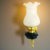 Brass wall sconce with frosted glass tulip lampshade