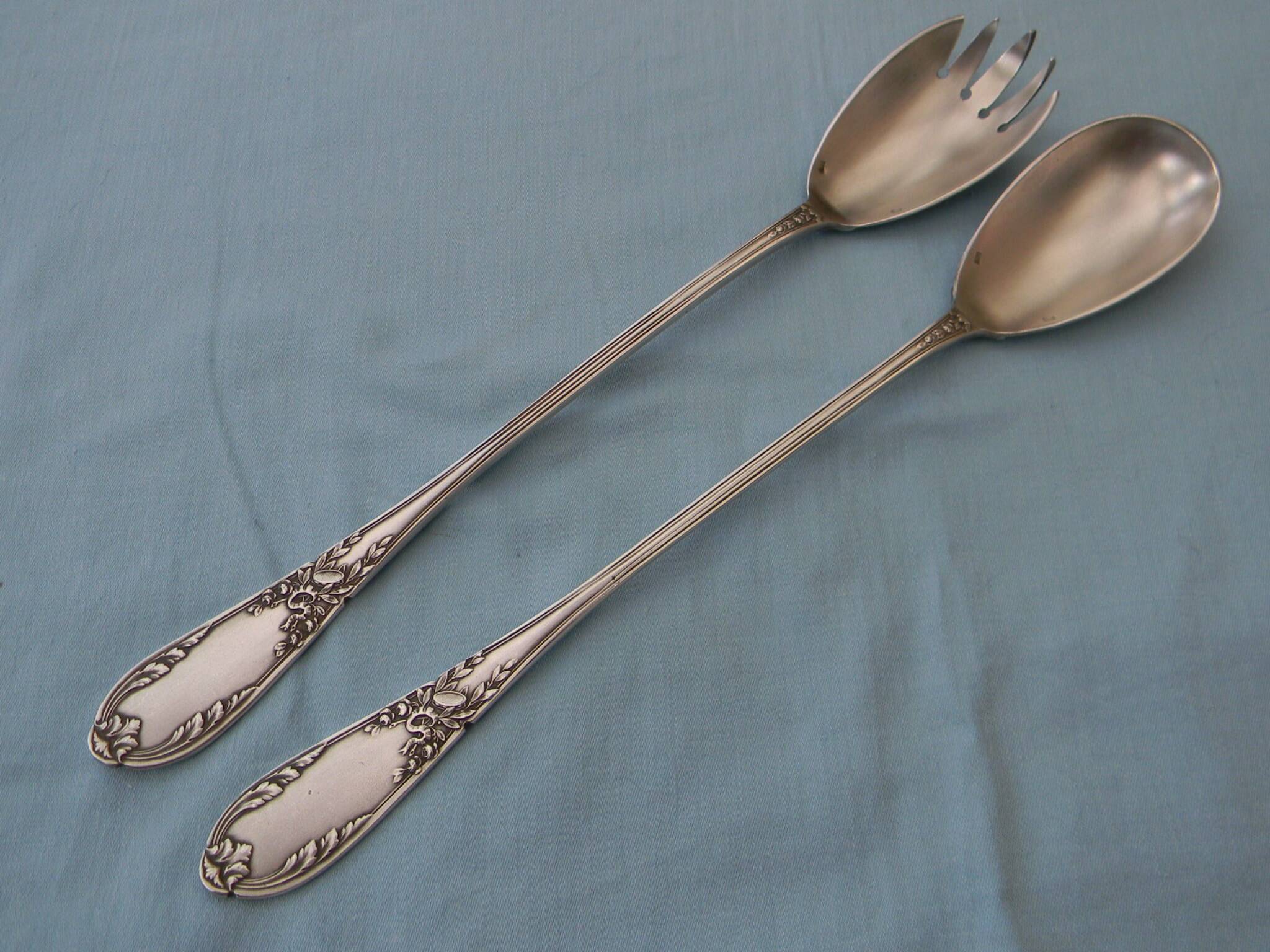 SFAM silver metal salad servers.
