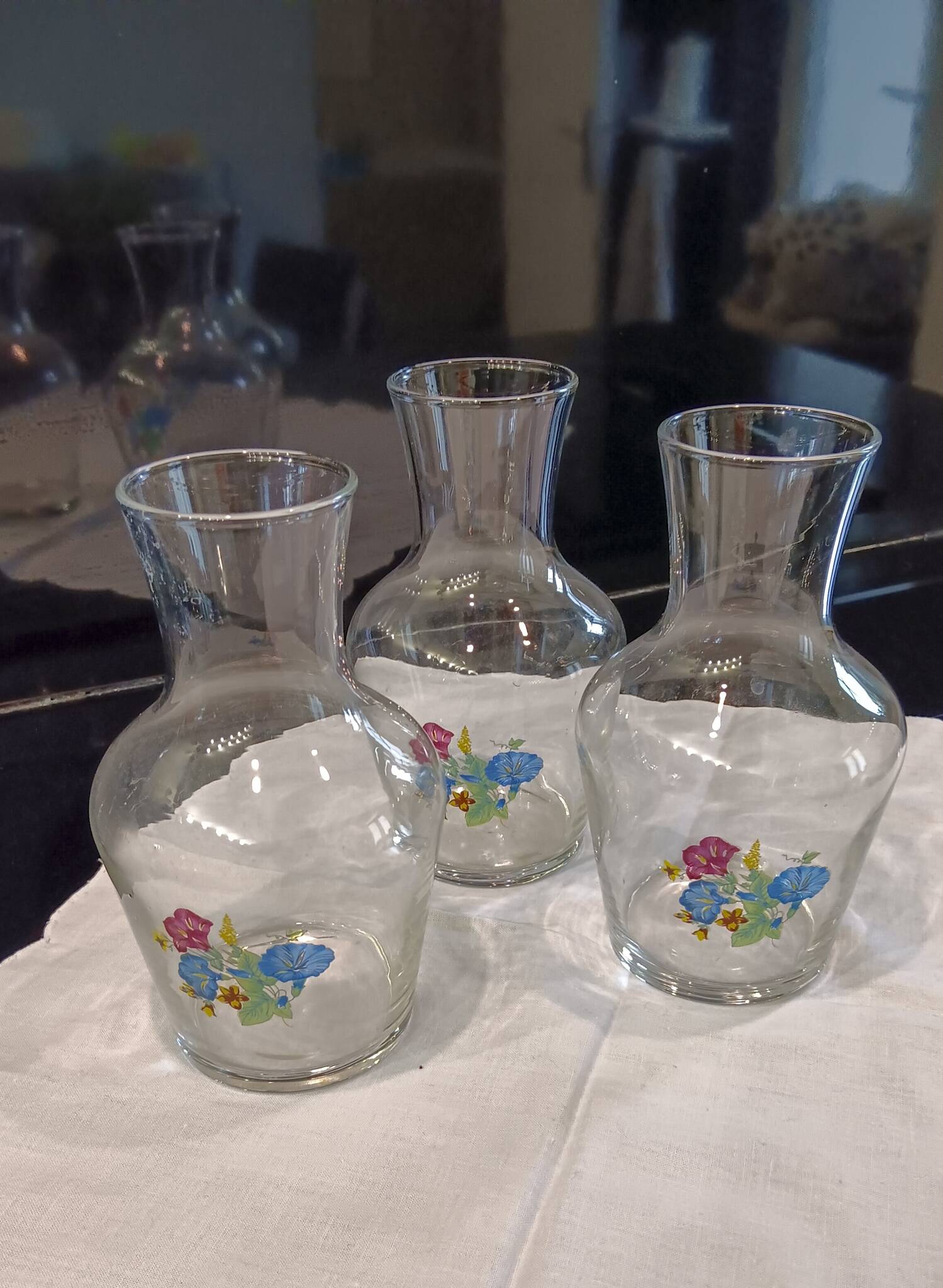 3 glass carafes, vintage. Very pretty floral pattern.
