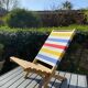 Folding chair in wood and striped fabric