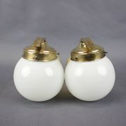 Pair of Art Deco wall sconces in brass and opaline glass, Europe, 1930s